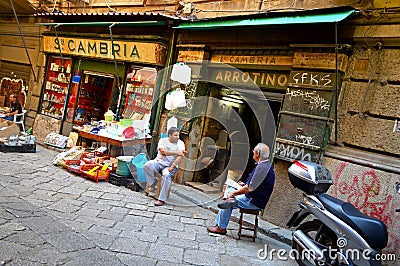Shop sellers chat in La Vucciria, the famous Market, Palermo Sicily Editorial Stock Photo